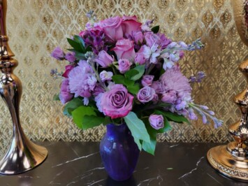 Purple roses and flowers arrangement